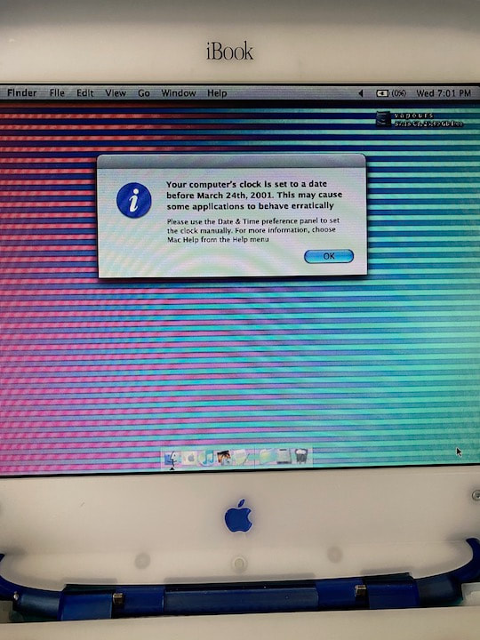 Photograph of iBook screen alert message. 
